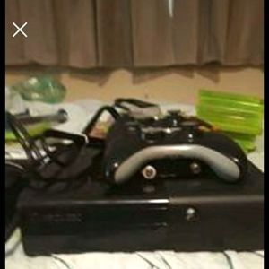 Xbox360e- 12 games, 2 wireless controllers, batteries for the controllers